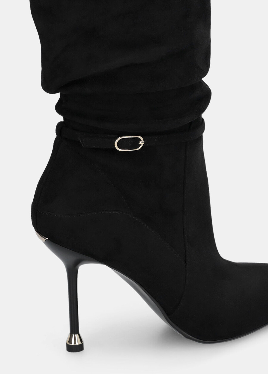 knee-high boots with decorative buckle