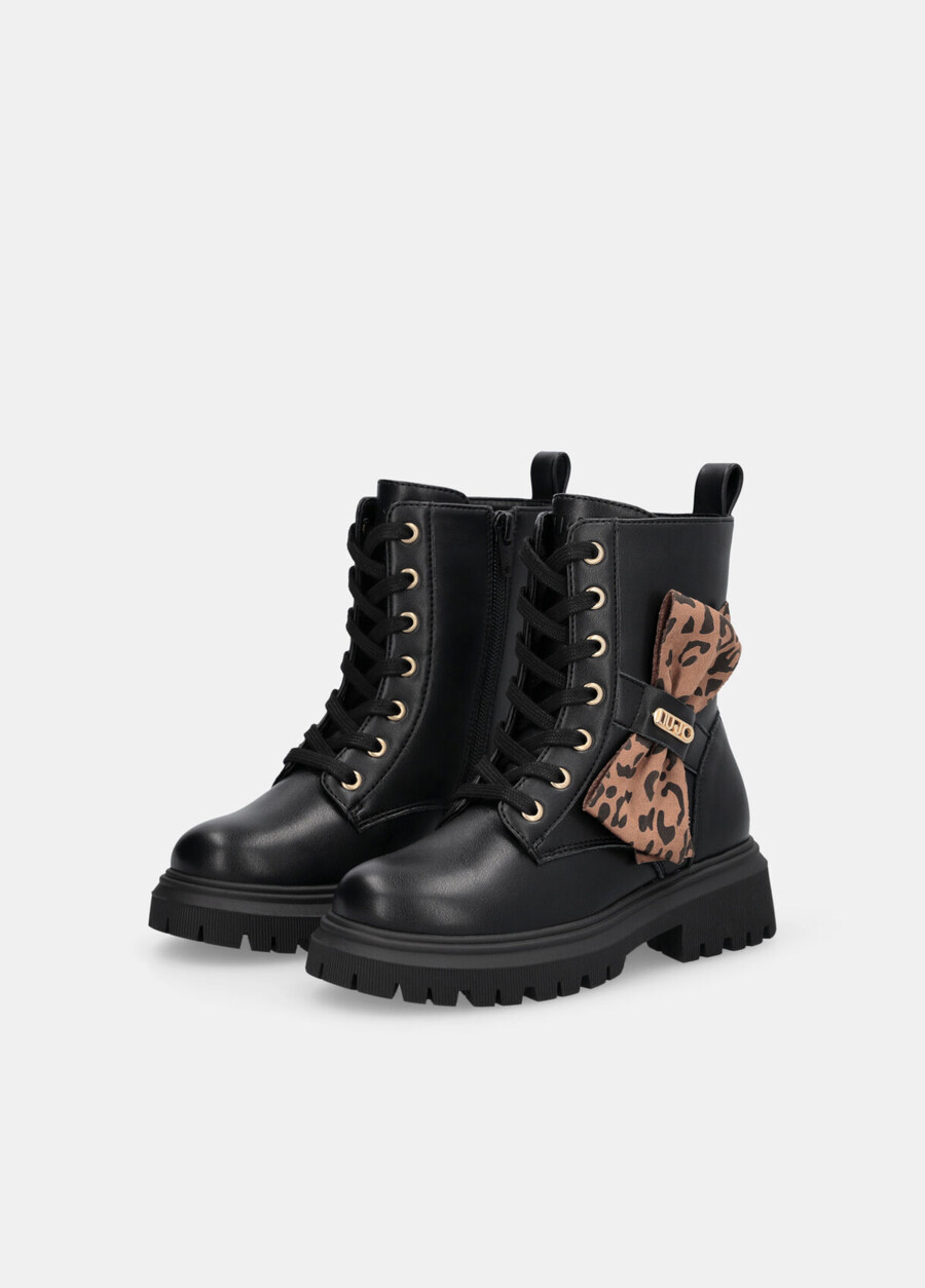 combat boots with animal-print bow
