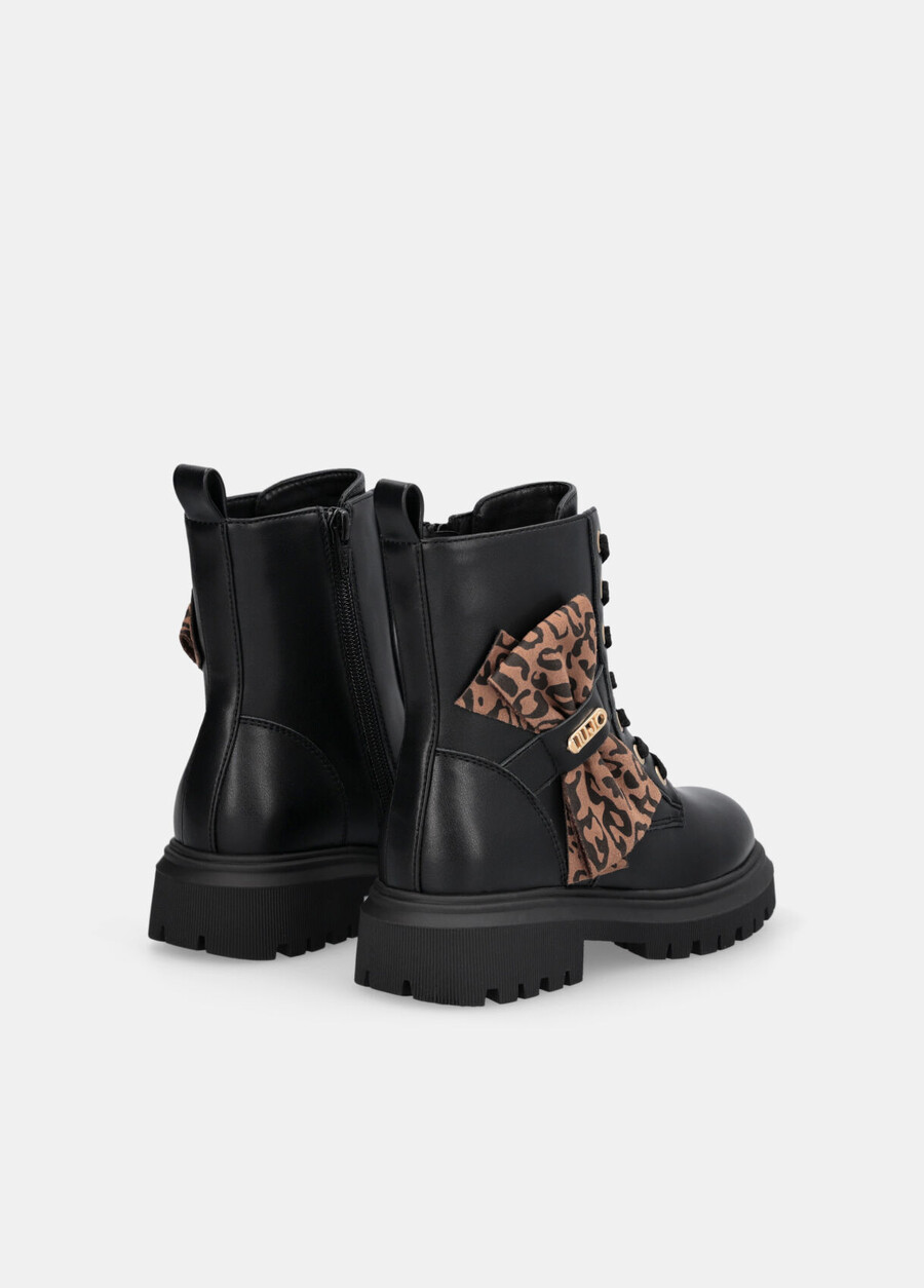 combat boots with animal-print bow