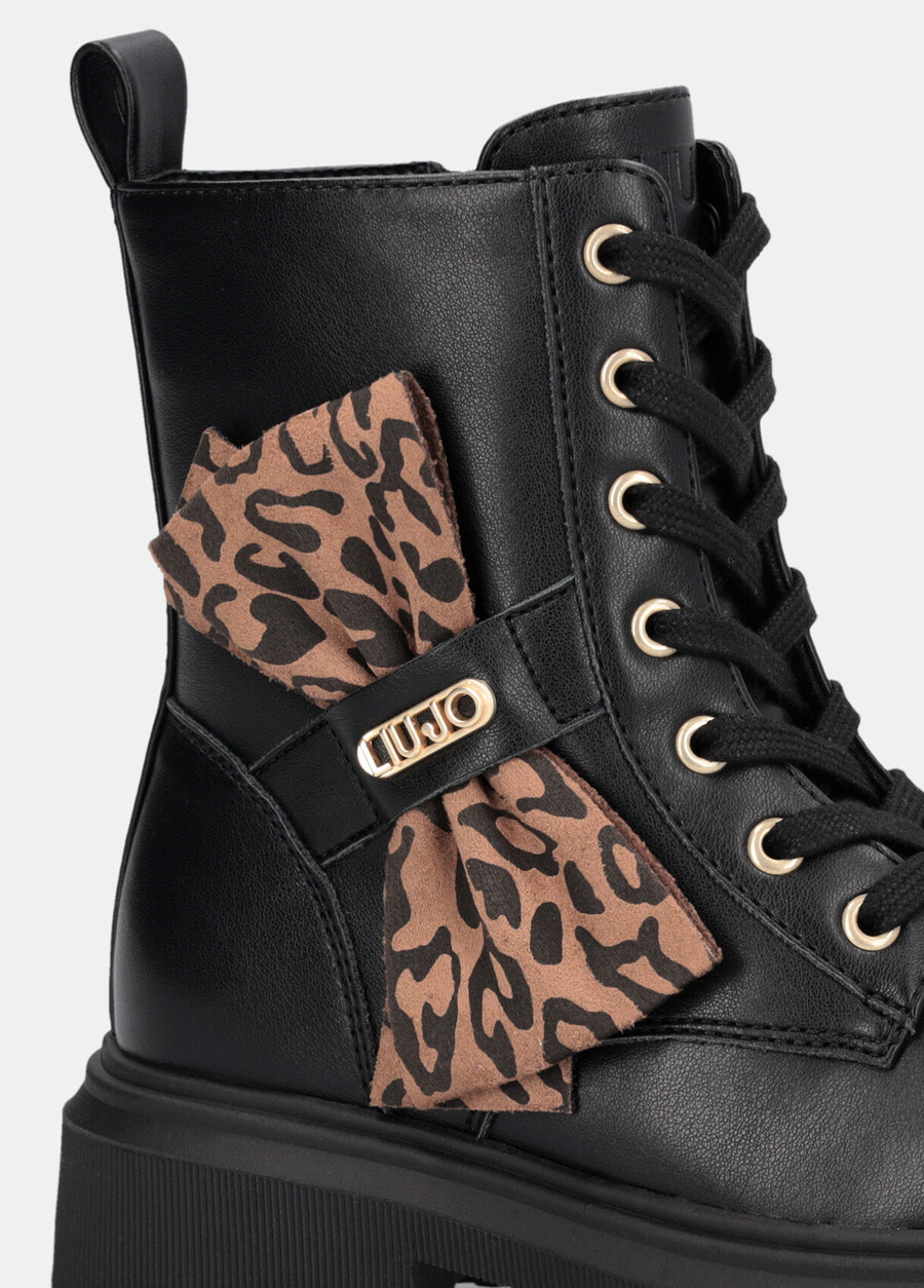 combat boots with animal-print bow