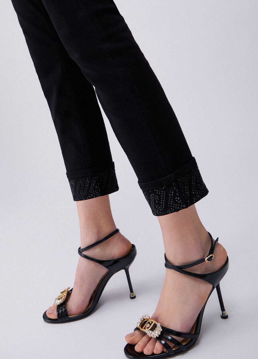 skinny trousers with turnups and gemstones